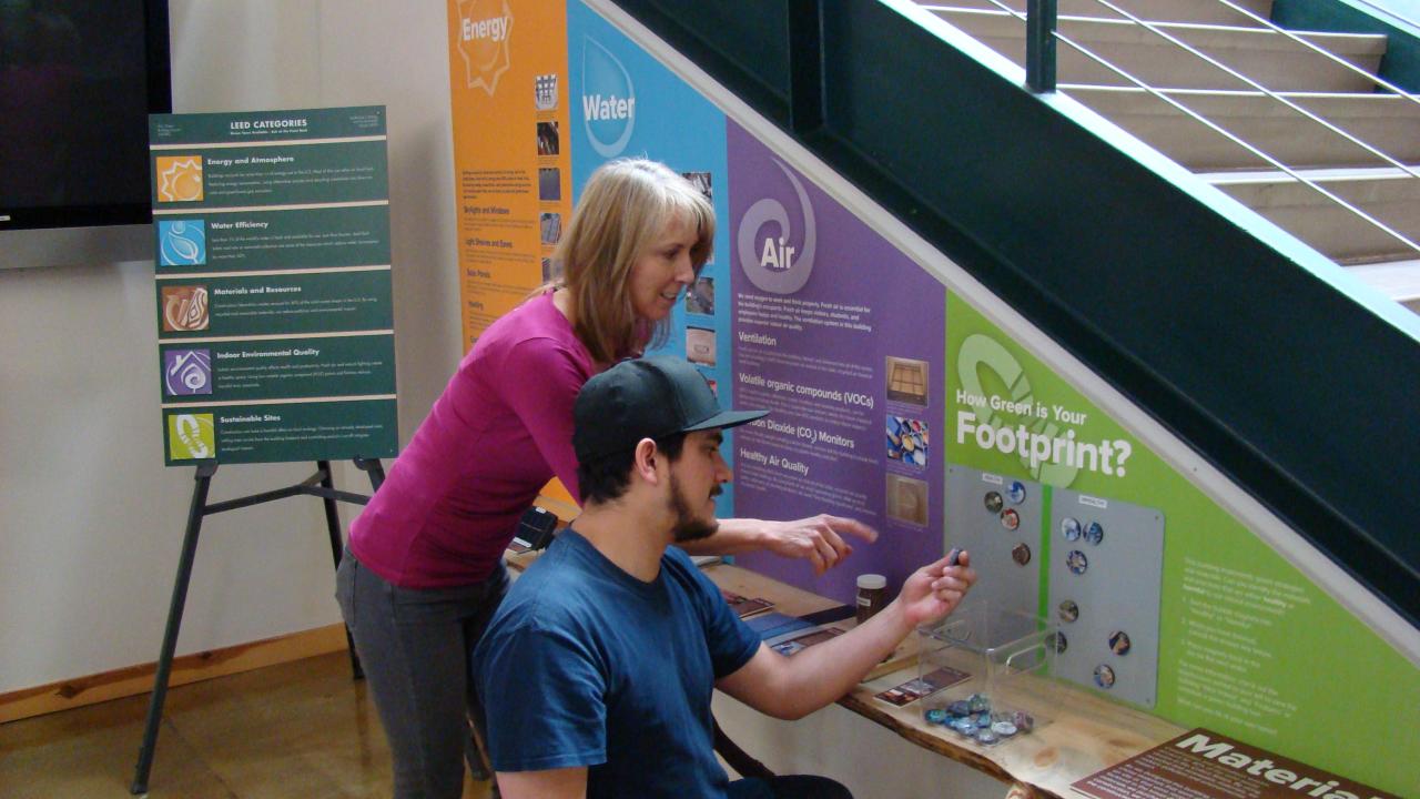 Two Visitors peer at the Green Building Exhibit in the Tahoe Science Center