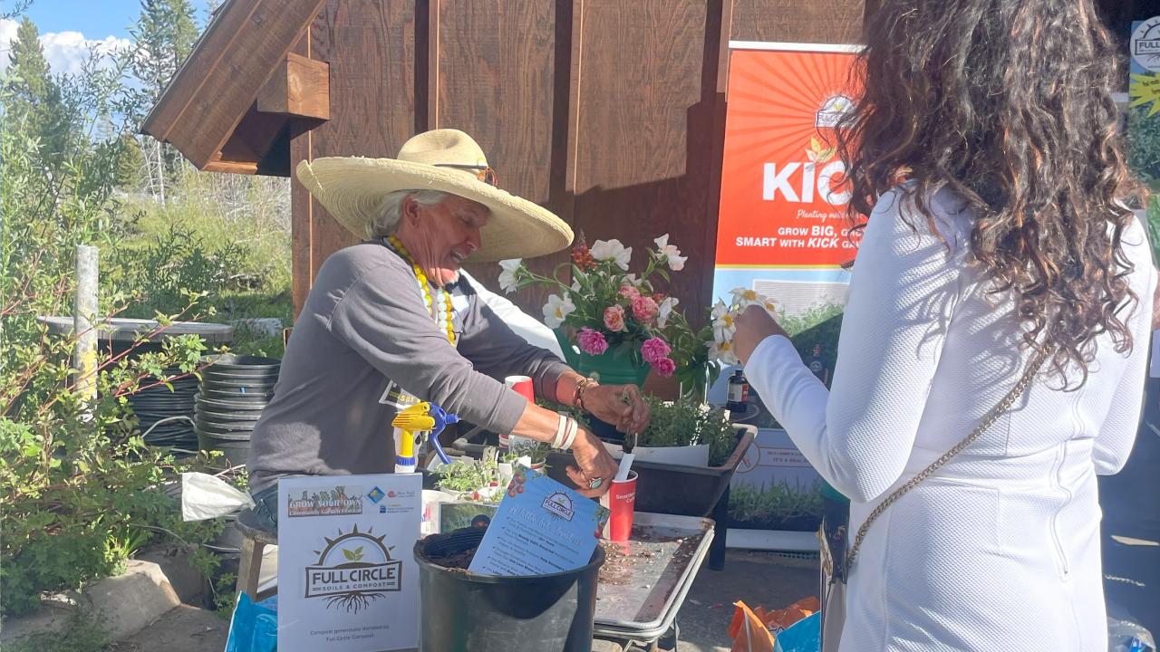 GYO attendee collects a free sample of compost from Full Circle compost