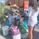 GYO attendee collects a free sample of compost from Full Circle compost