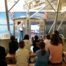 Students listen to lecture on the virtual Boat