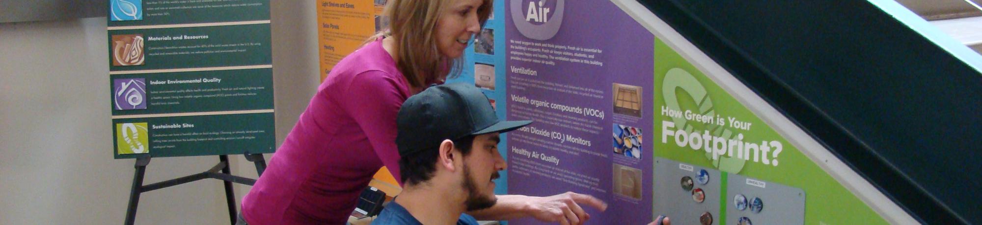 Two Visitors peer at the Green Building Exhibit in the Tahoe Science Center