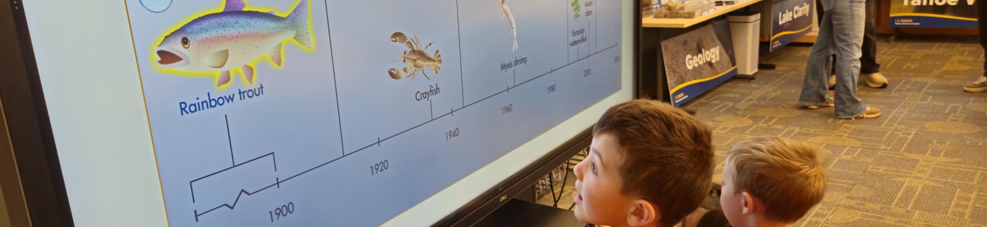 Two young visitors explore exhibits at the Tahoe Science Center